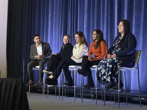 Geetha participating in a panel discussion with other speakers